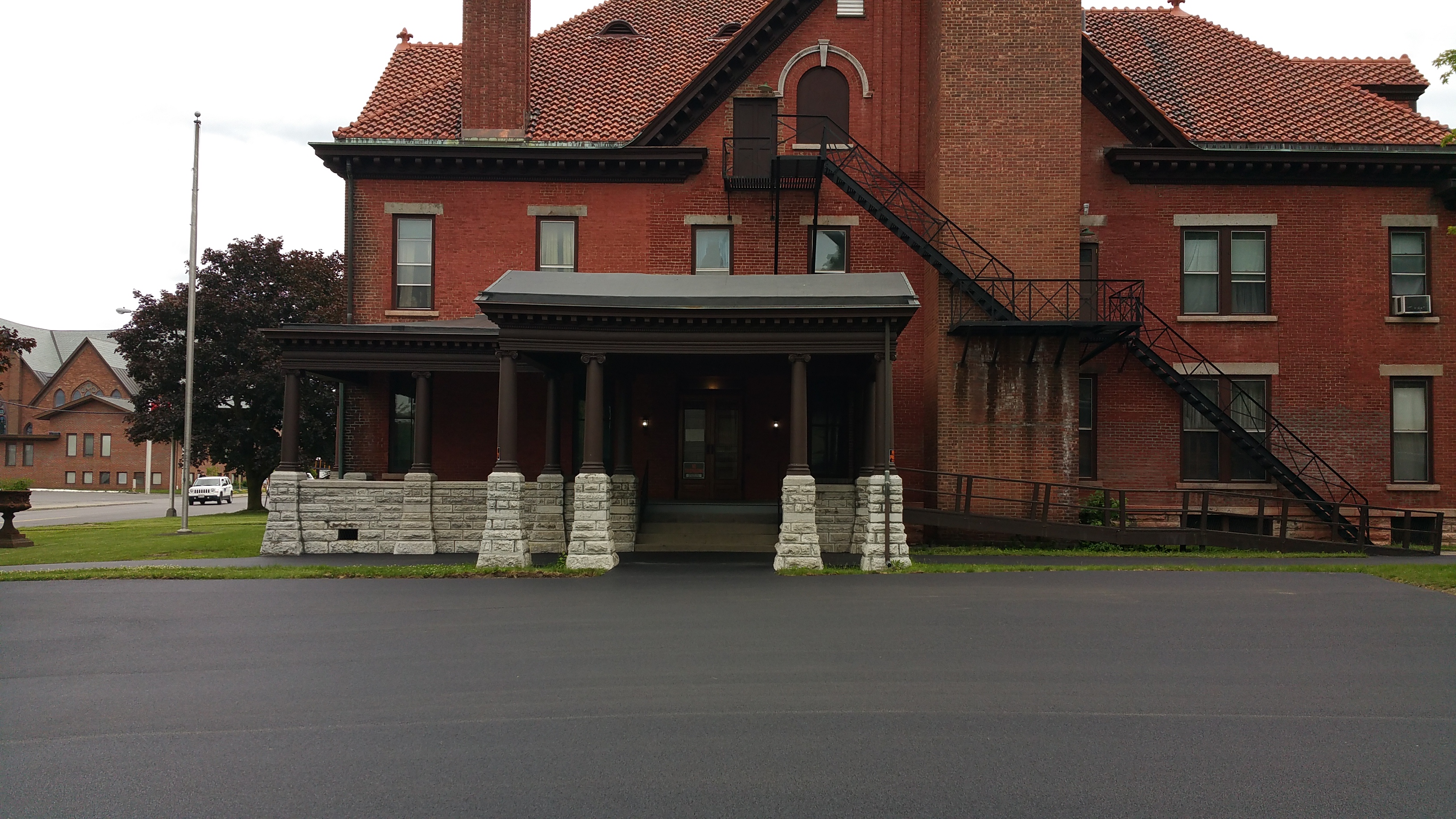 Paved walkway to the portico.